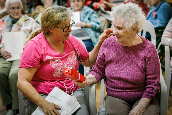 Elderly Woman with a Present