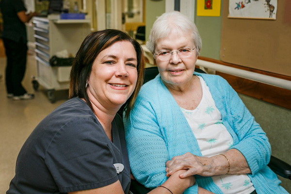 An Elderly Woman with a Nurse